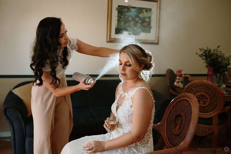 Bride getting hairspray lake Tinaroo wedding photos